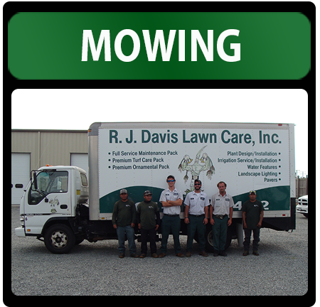 Staff members in front of a truck and turf care in Ashland, VA.